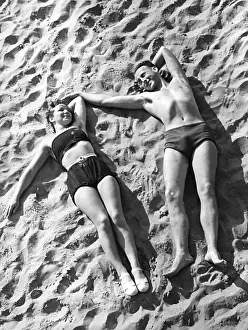 Lighthearted: Young couple sunbathing, 1939