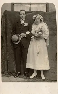 Buttonhole: Young couple in wedding costume