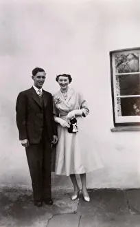 Buttonhole: Young couple in wedding costume
