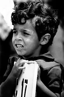 Fairgrounds: Young Cuban boy at refugee camp