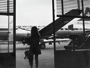 Swissair: Young girl at an airport