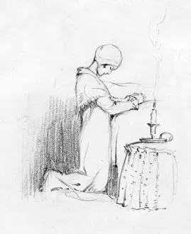 Prays: A young girl prays before bed