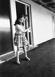 Spins: Young girl spinning a top in Sheffield