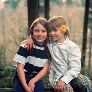 Del002: Two Young Girls With Flowers In
