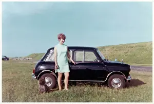 Iconic: Young lady, terrier and Mini Cooper car