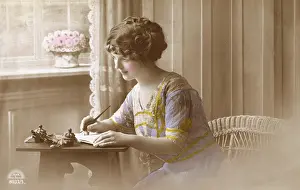 Young lady writing a letter