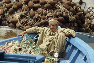 Unwind: Young man in boat, Tunisia