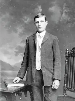 The Roger Worsley Archive: Young man with book and table, Mid Wales