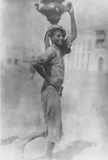 Suakin: A young man carries a beautiful pitcher. Suakin