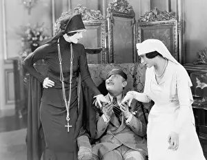 Consoling: Young man with an eye patch being consoled by a