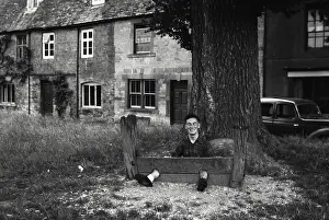 Fooling: Young man fooling about in The Stocks