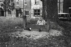 Fools: Young man fools about in The Stocks