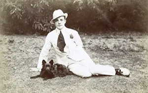 Dapper: Young man in garden with small dog