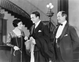 Formalwear: Young man greeting a woman