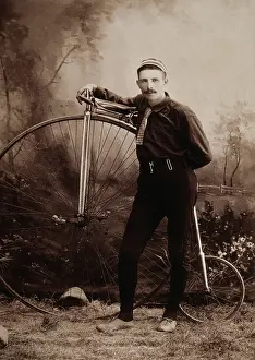 Costumed: Young man with a pennyfarthing bicycle