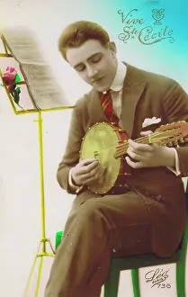 Effete: A young man playing the Banjolele, Paris, 1920s