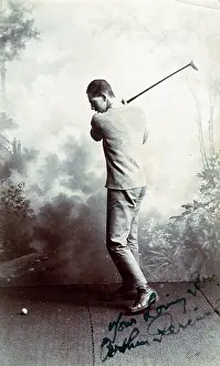 Golfing: A Young man playing a golf shot - studio photograph