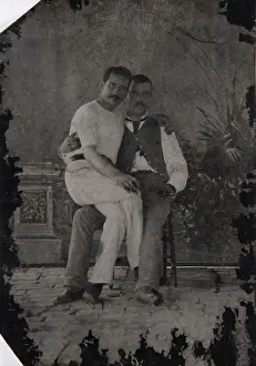 Unbuttoned: Young man sitting on the lap of a