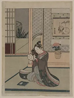 Hotei: Young man striking a drum