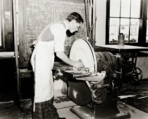Grades: Young Man Vocational Student working at a Sanding Wheel