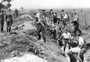 Shoveling: Young men dig trenches, 1936