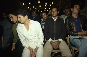 1987egypt: Young men listening to a speech at a rally ?