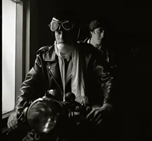 Handlebars: Two young men on a motorcycle