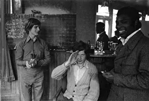 Chalked: Young men playing darts in a pub