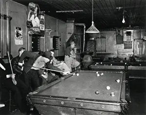 Midwest: Young men playing pool on a weeknight in Shelby