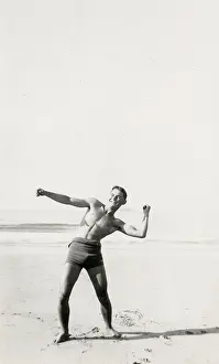 Healthy: Young, muscular man on the beach