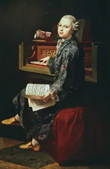 Keyboard: Young musician at the keyboard. Thought by some