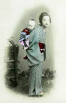 Young nurse carrying a baby