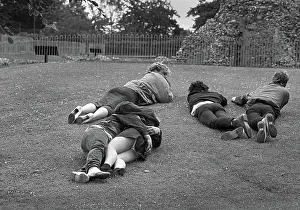 Cuddling: Five young people on grass - Abbey Gardens, Bury St. Edmunds