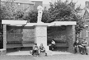 Winsford: Young people sitting by war memorial, Winsford, Cheshire