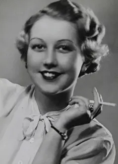 Lowy: Young smiling woman with cigarette