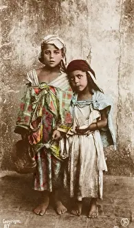 Tatters: Two young Tunisian beggar children