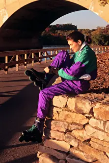 Inline: Young Woman Adjusting Rollerblades in Fairmount