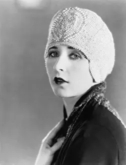 Insecurity: Young woman in beaded cap