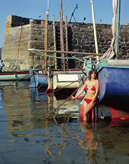 Coverack: Young woman in bikini, Coverack, Cornwall