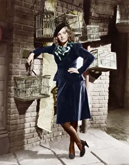 Avian: Young woman and birdcages
