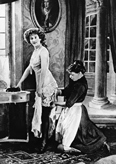 Distinguished: Young woman dressing, 1921