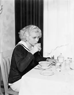 Breakfasts: Young woman having breakfast in a restaurant