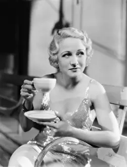 Teacup: Young woman holding a cup of tea