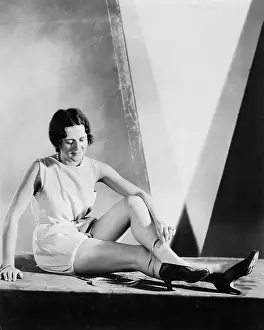 20 25: Young woman measuring her ankles