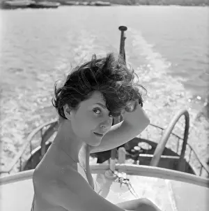 Windswept: Young woman modelling on a boat