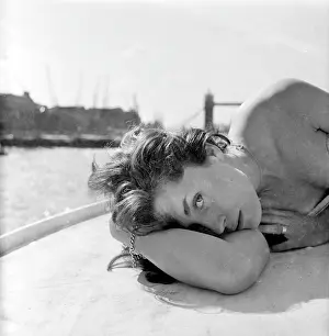 Windswept: Young woman modelling on a boat
