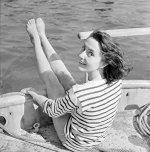 Windswept: Young woman modelling on a boat