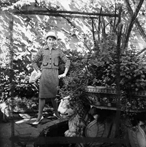 Colin Sherborne Collection: Young woman modelling a suit in a garden