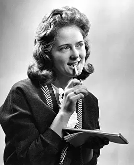 Shorthand: Young woman with notebook and pen
