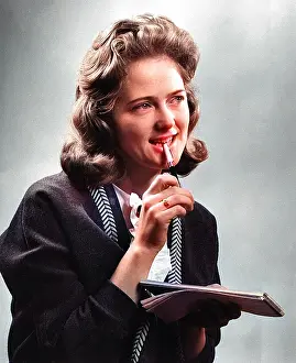 Shorthand: Young woman with notebook and pen